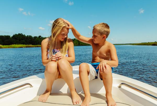 Slide: The Image of Children enjoying a sunny day on a 2024 Key West 189 FS boat. - 22