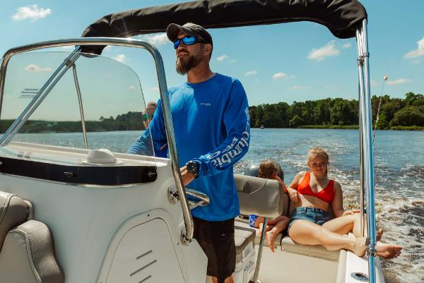 Slide: The Image of 2024 Key West 189 FS boat cruising with family on a sunny day. - 23