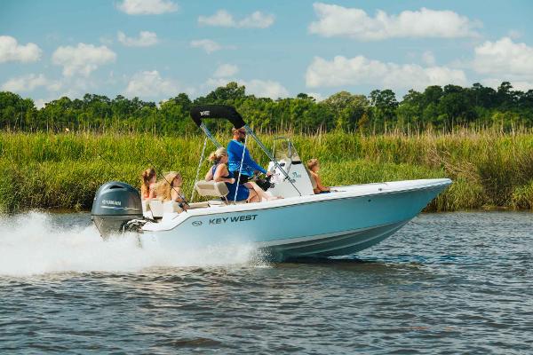 Slide: The Image of 2024 Key West 189 FS boat cruising on a river with passengers. - 25