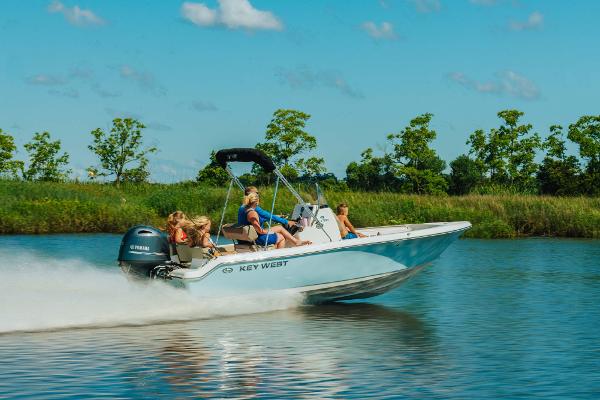 Slide: The Image of 2024 Key West 189 FS boat speeding on a lake with passengers. - 28