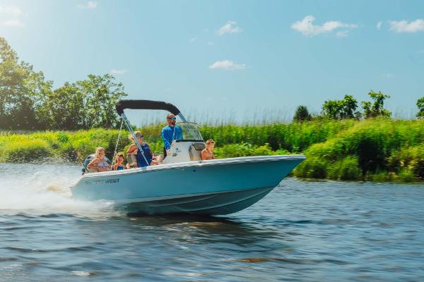 Slide: The Image of 2024 Key West 189 FS boat cruising on a sunny day with passengers. - 29