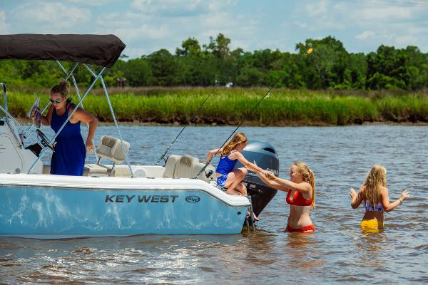 Slide: The Image of Family enjoying a day on the water with a 2024 Key West 189 FS boat. - 31