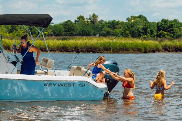 Slide: The Image of Family enjoying a day on the water with a 2024 Key West 189 FS boat. - 32