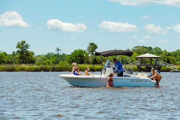 Slide: The Image of 2024 Key West 189 FS boat on a lake with people enjoying the water. - 37