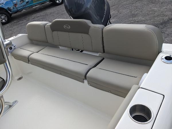Slide: The Image of 2024 Key West 189 FS boat with cushioned seating and cup holders. - 5