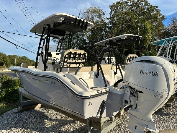 Slide: The Image of 2024 Key West 219 FS boat with Yamaha engine on display outdoors. - 2