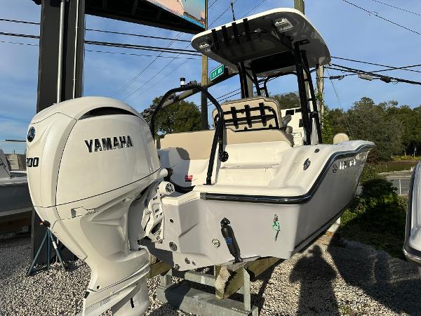 Slide: The Image of 2024 Key West 219 FS boat with Yamaha engine displayed outdoors. - 4