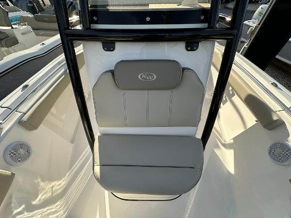 Slide: The Image of 2024 Key West 219 FS boat interior with cushioned seating and sleek design. - 6