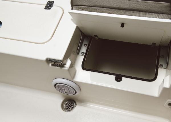 Slide: The Image of 2023 Key West 250 Bay Reef storage compartment and speaker detail. - 25