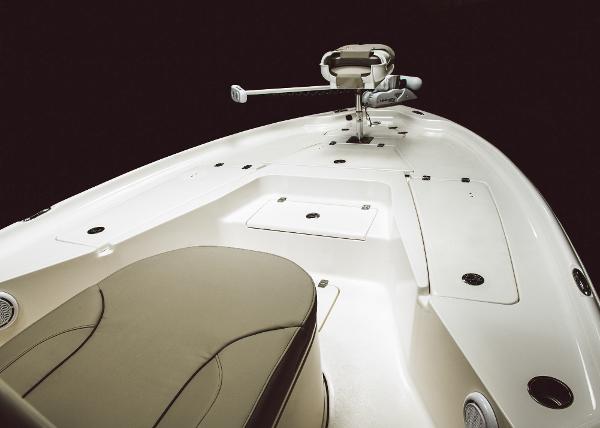 Slide: The Image of 2023 Key West 250 Bay Reef boat interior with seating and storage compartments. - 28