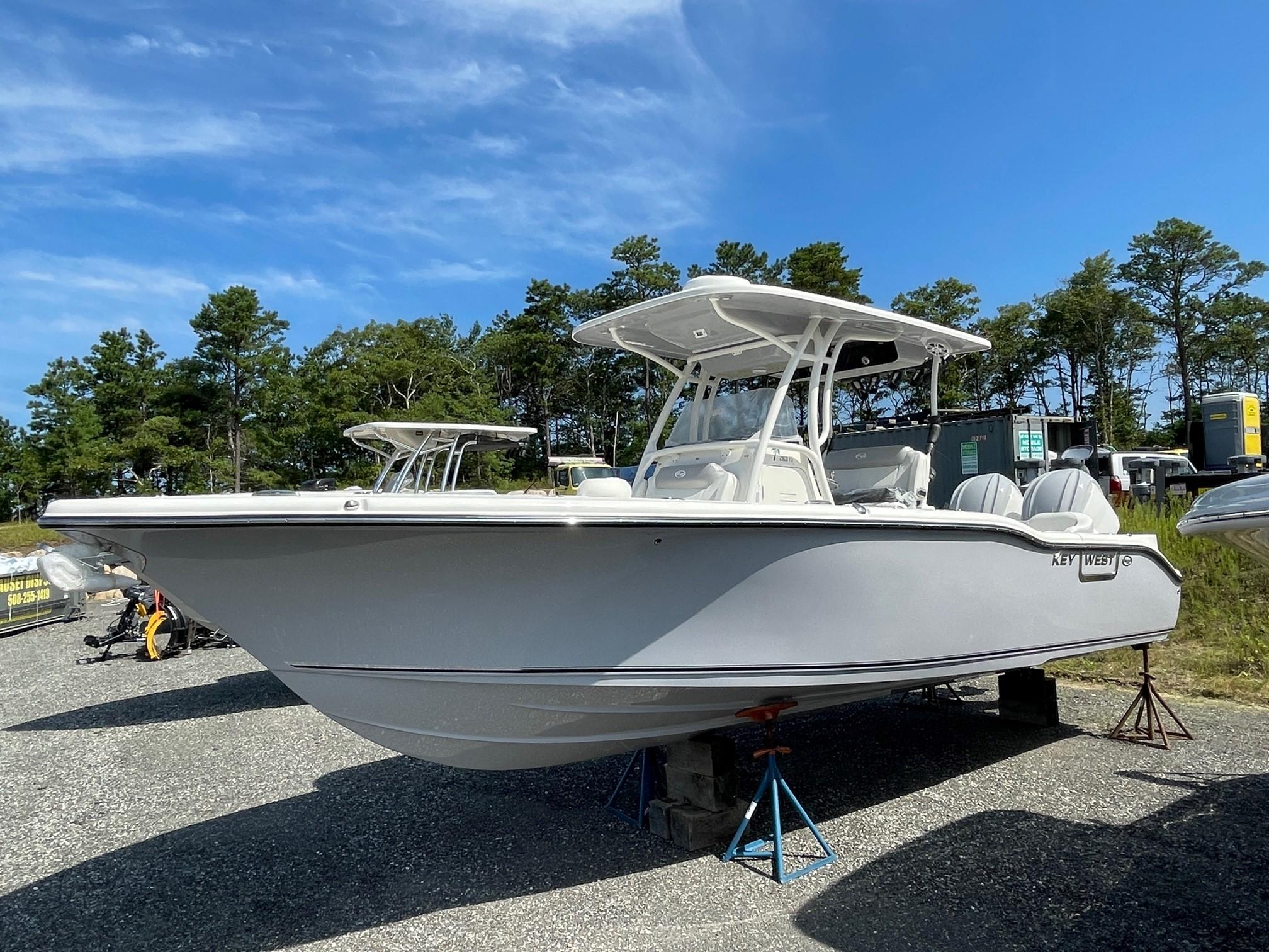 Slide: The Image of 2024 Key West 263 FS boat on display outdoors. - 0