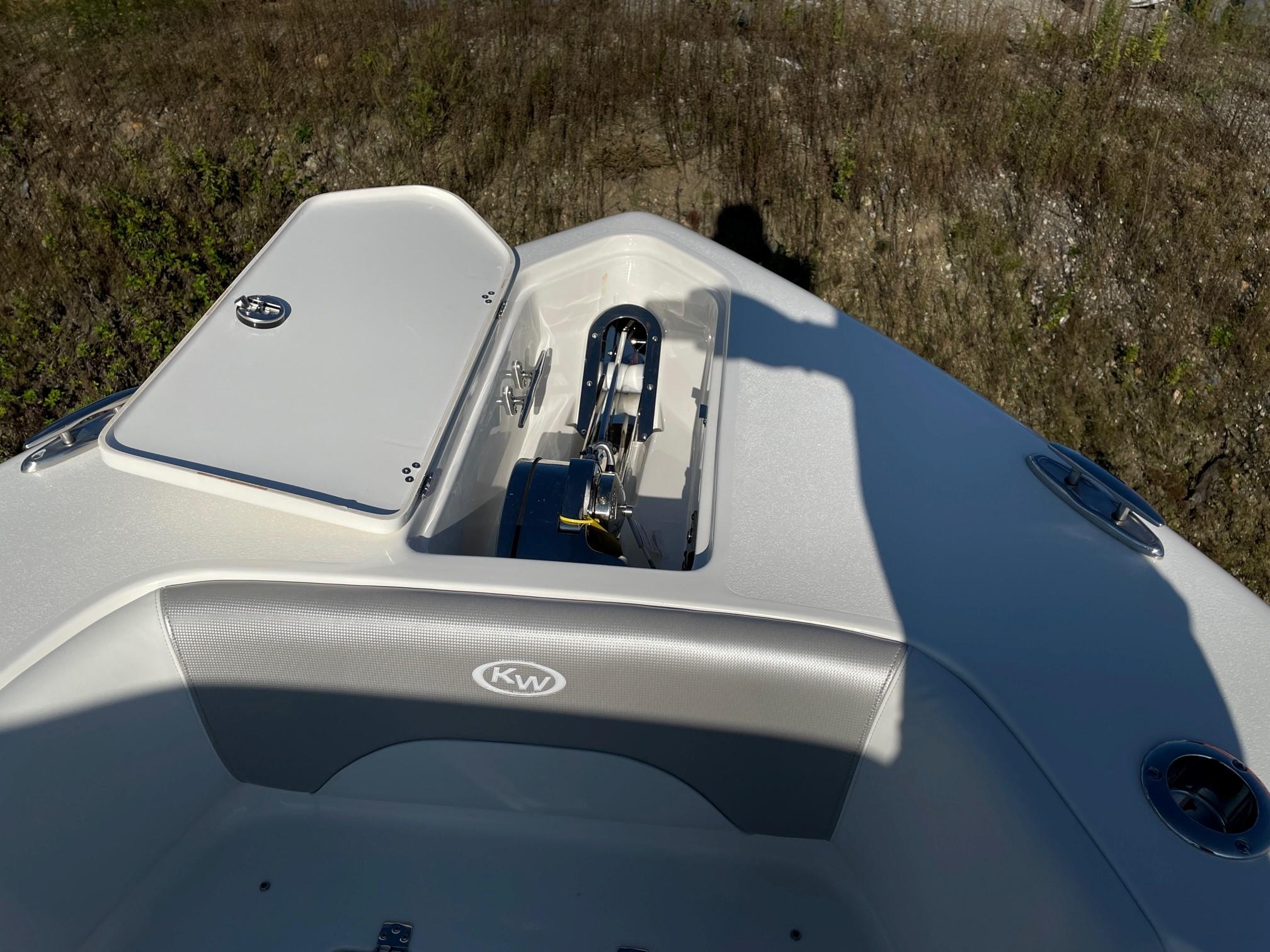 Slide: The Image of 2024 Key West 263 FS boat bow with anchor storage compartment. - 4