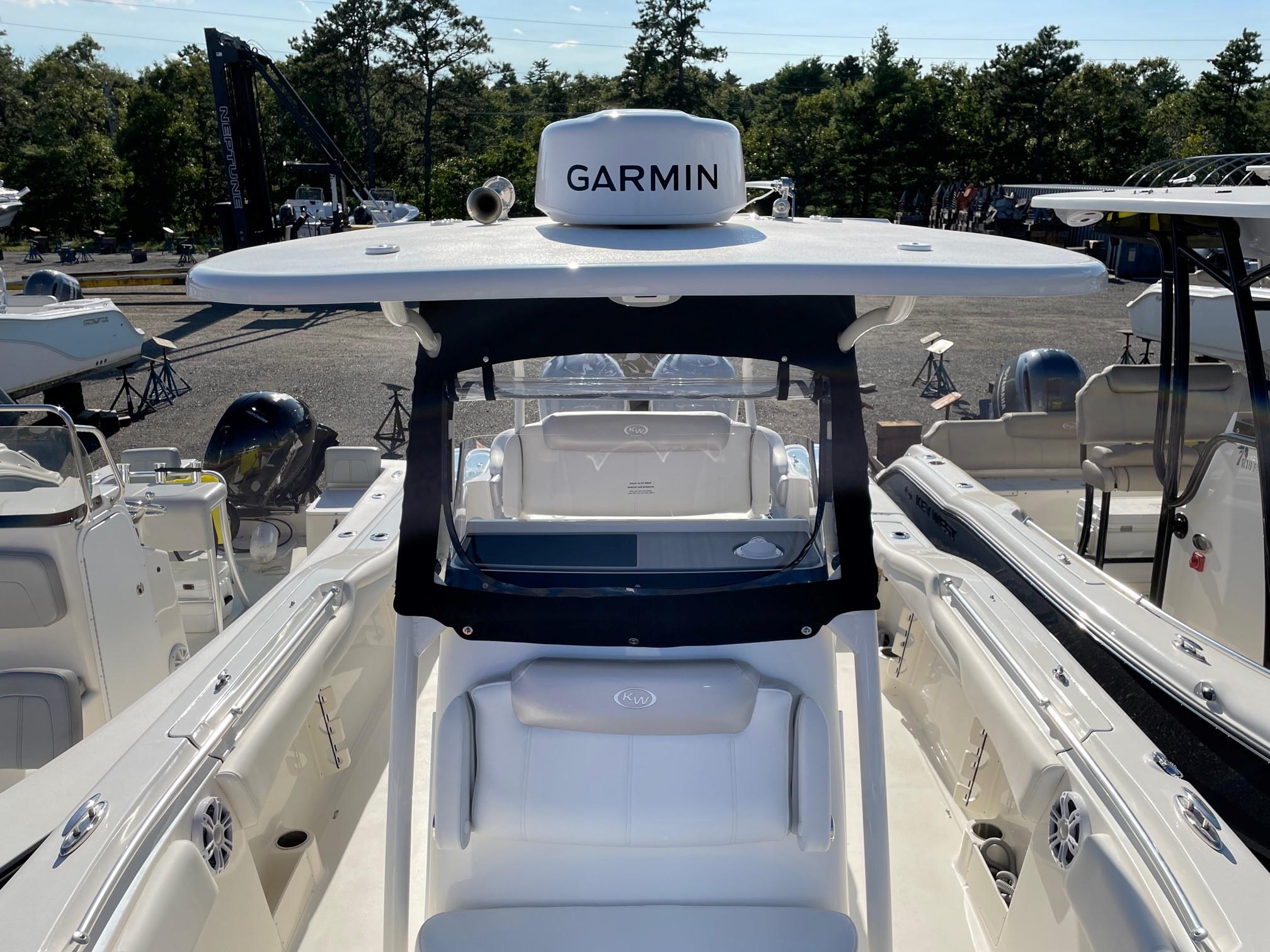 Slide: The Image of 2024 Key West 263 FS boat with Garmin navigation system, docked in a marina. - 5