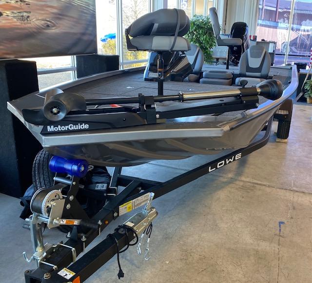 Slide: The Image of 2024 Lowe Stinger 175 Crappie fishing boat on trailer with MotorGuide trolling motor. - 0