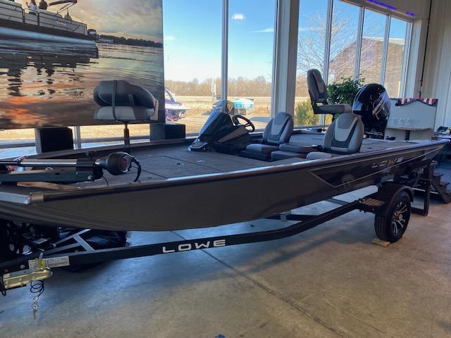 Slide: The Image of 2024 Lowe Stinger 175 Crappie fishing boat displayed indoors. - 1