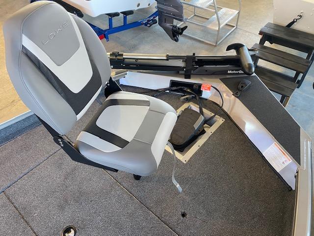 Slide: The Image of 2024 Lowe Stinger 175 Crappie boat interior with a gray and black seat and trolling motor. - 11