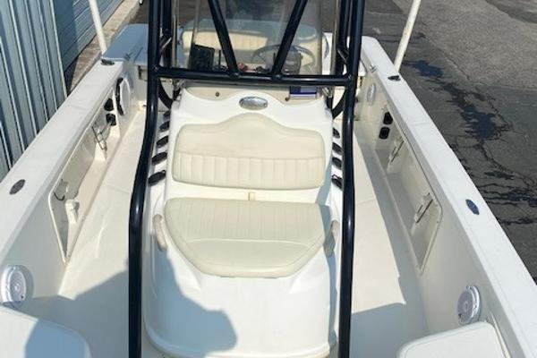 Slide: The Image of 2011 Mako 2201 Inshore boat with white seating and black frame. - 8