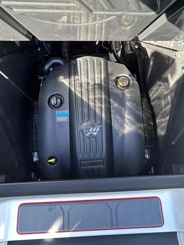 Slide: The Image of 2024 Malibu M220 engine compartment with a clean, modern engine cover. - 20