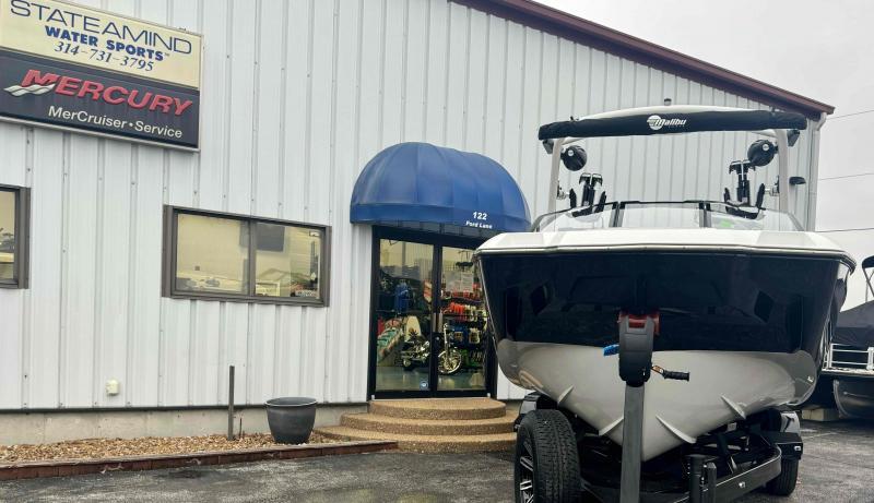 Slide: The Image of 2024 Malibu M220 boat displayed outside Stateamind Water Sports dealership. - 4