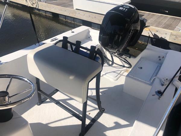 Slide: The Image of 2021 May-Craft 1800 Skiff boat interior with seating and outboard motor. - 6