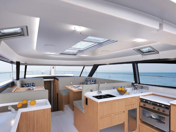 Slide: The Image of Luxurious interior of 2025 Moody 48 Deck Saloon yacht with modern kitchen and ocean view. - 7