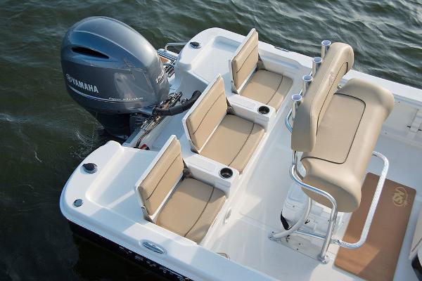 Slide: The Image of 2023 NauticStar 215 XTS boat with Yamaha engine and beige seating. - 11