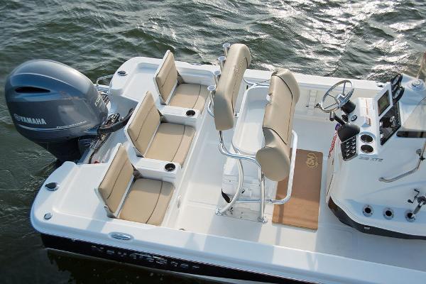 Slide: The Image of 2023 NauticStar 215 XTS boat interior with Yamaha engine on water. - 12