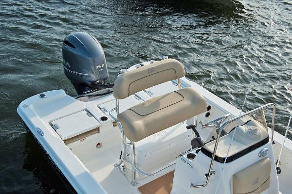 Slide: The Image of 2023 NauticStar 215 XTS boat with Yamaha 150 engine on water. - 13