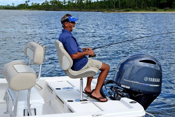 Slide: The Image of Man fishing on a 2023 NauticStar 215 XTS boat with Yamaha outboard motor. - 20