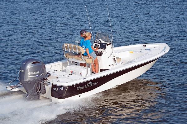 Slide: The Image of 2023 NauticStar 215 XTS boat cruising on water with Yamaha outboard motor. - 4