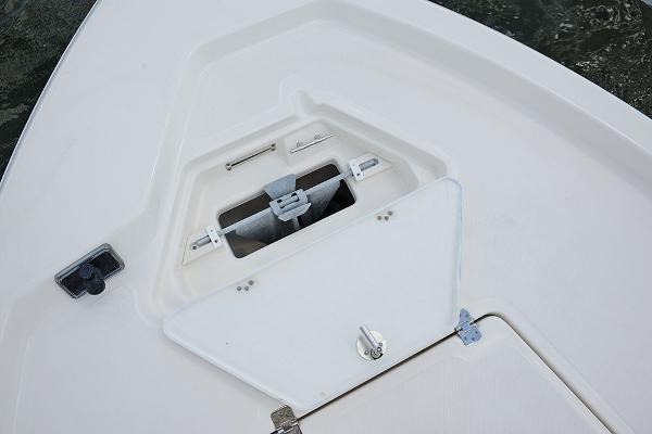 Slide: The Image of 2023 NauticStar 215 XTS boat anchor storage compartment. - 8