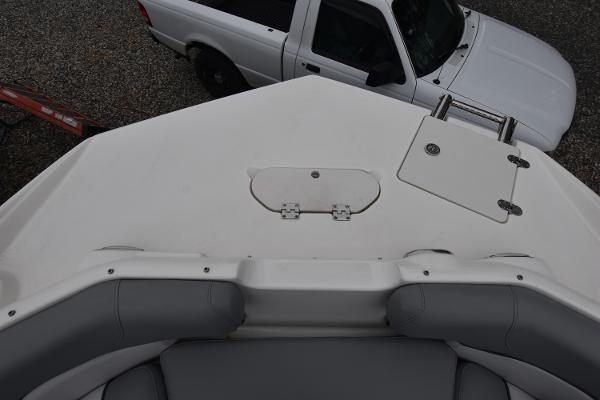 Slide: The Image of 2021 NauticStar 223 DC boat bow with white truck in background. - 11
