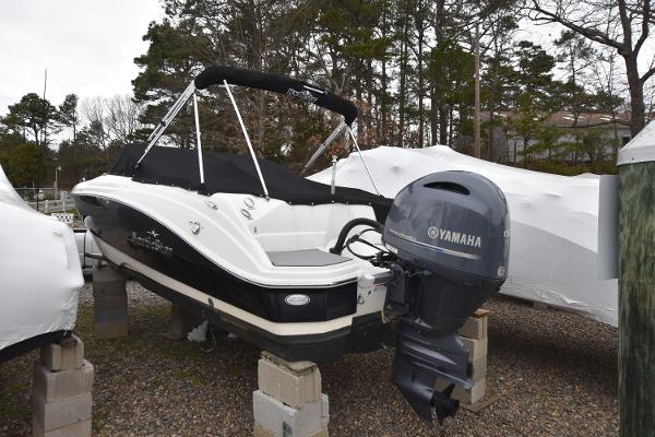 Slide: The Image of 2021 NauticStar 223 DC boat with Yamaha outboard motor on dry dock. - 2