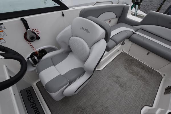 Slide: The Image of 2021 NauticStar 223 DC boat interior with gray and white seating. - 5