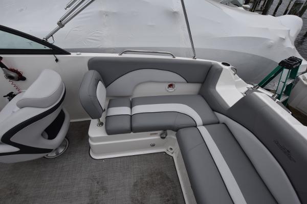 Slide: The Image of 2021 NauticStar 223 DC boat interior with gray and white seating. - 7