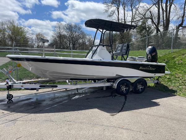 Slide: The Image of 2023 NauticStar 227 Bay boat on a trailer, ready for transport. - 0