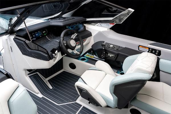 Slide: The Image of 2023 Nautique Super Air Nautique G25 Paragon cockpit with modern controls and luxurious seating. - 21