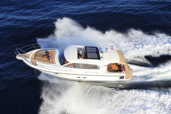Slide: The Image of Nimbus 405 Coupé 2025 cruising on open water. - 4