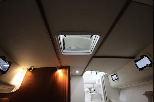 Slide: The Image of Interior view of 2024 NorthCoast 285HT boat cabin with skylight and modern design. - 21