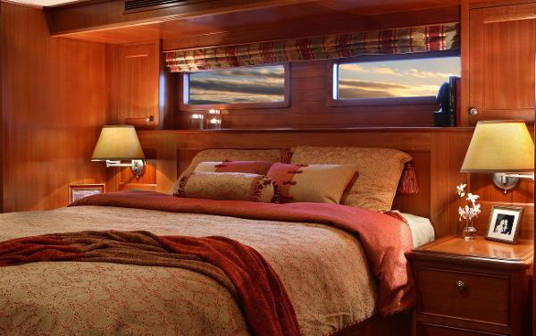 Slide: The Image of Luxurious bedroom interior of 2025 Northern Marine 64 yacht with elegant wooden finish. - 4