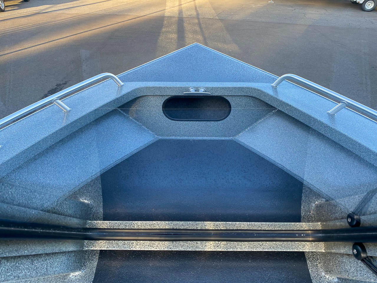 Slide: The Image of 2025 North River 22 Seahawk boat bow with metal railings and textured flooring. - 10