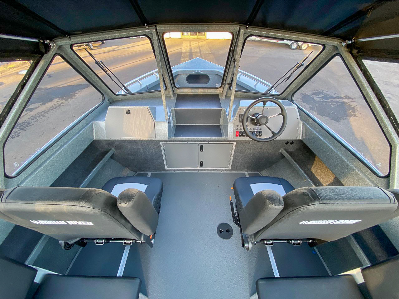 Slide: The Image of Interior of 2025 North River 22 Seahawk boat with dual seats and steering console. - 11