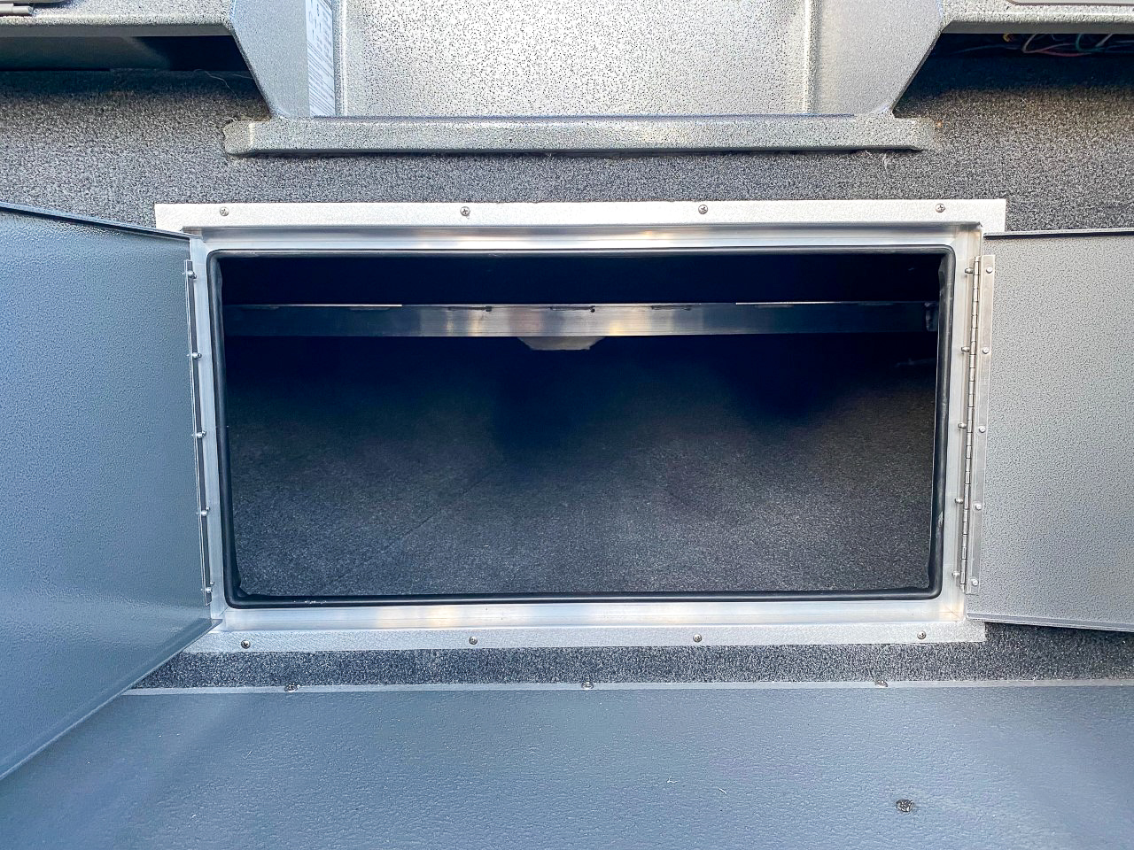 Slide: The Image of Open storage compartment of 2025 North River 22 Seahawk boat. - 12