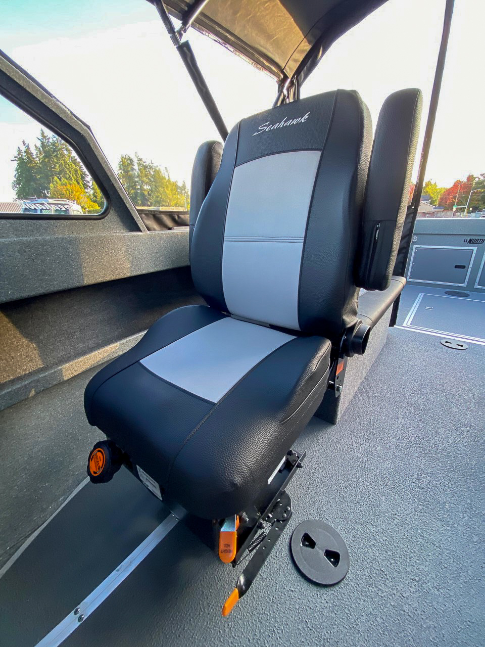 Slide: The Image of 2025 North River 22 Seahawk boat interior seat with Seahawk branding. - 15
