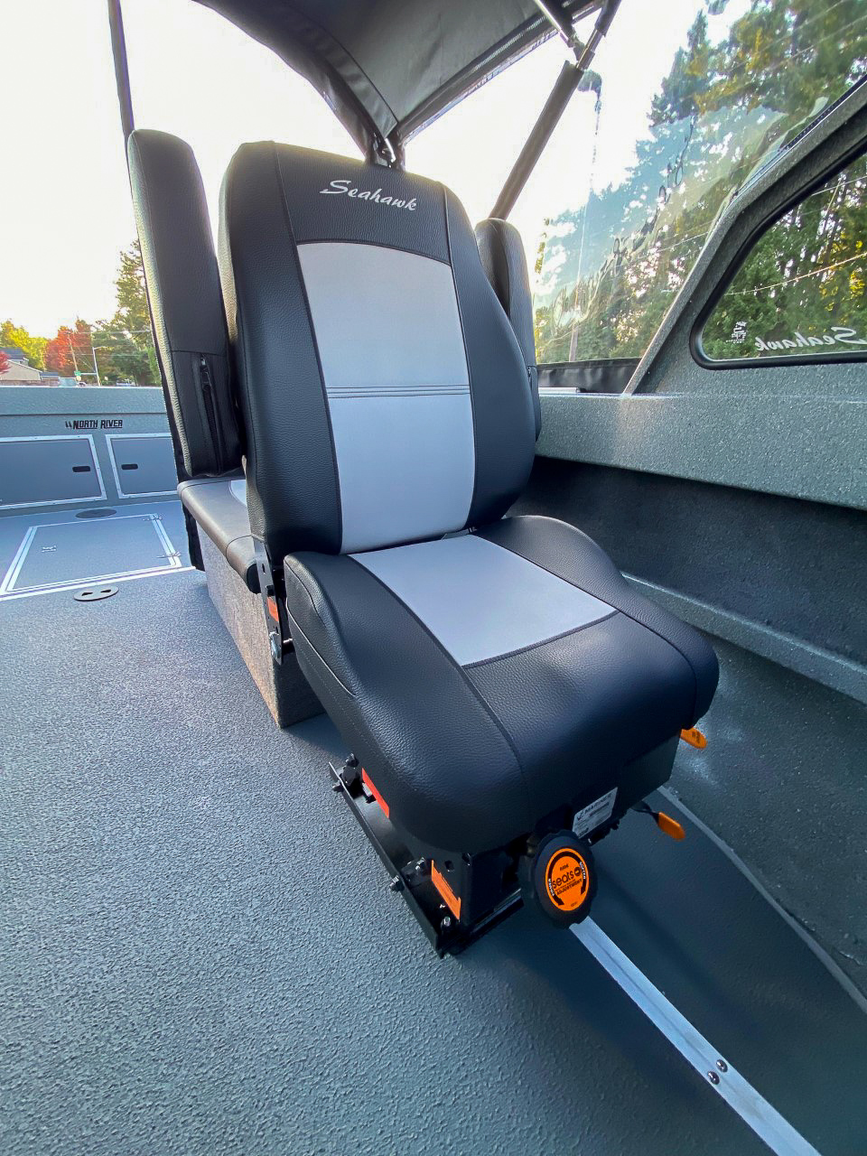 Slide: The Image of Captain's seat in 2025 North River 22 Seahawk boat, black and gray upholstery. - 16