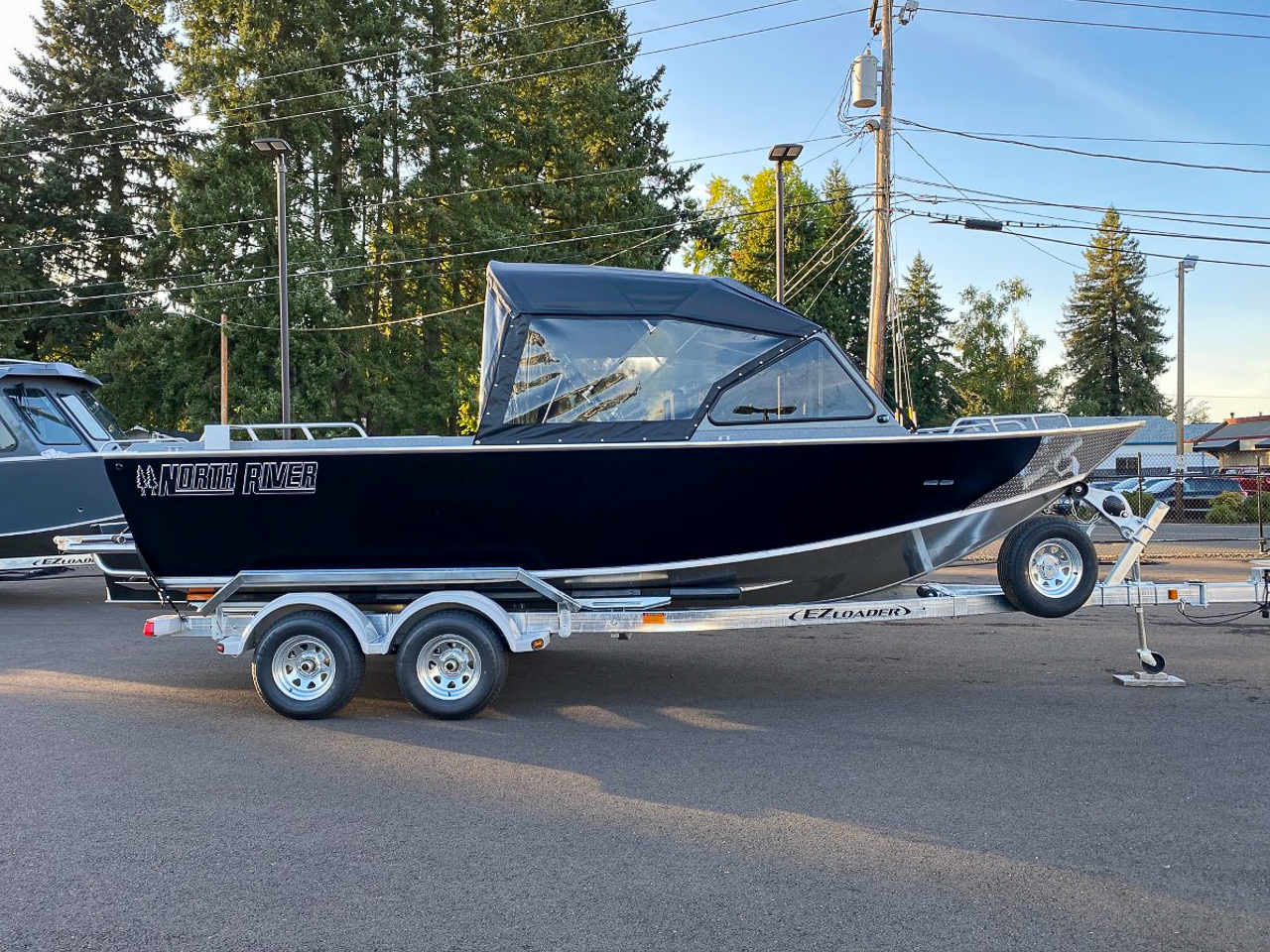 Slide: The Image of 2025 North River 22 Seahawk boat on trailer in outdoor setting. - 2