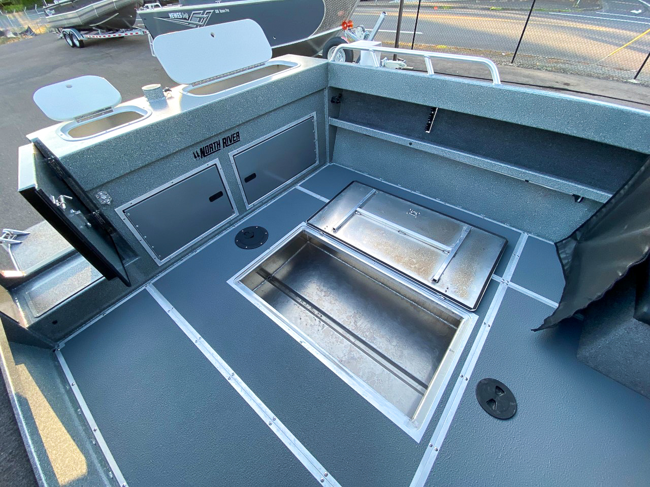 Slide: The Image of 2025 North River 22 Seahawk boat interior with storage compartments and livewell. - 21