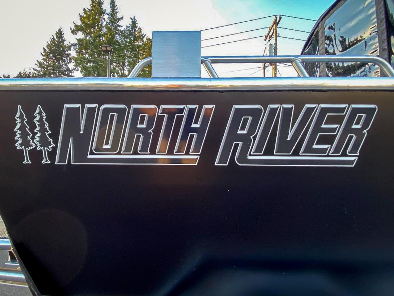 Slide: The Image of 2025 North River 22 Seahawk boat logo with trees - 29