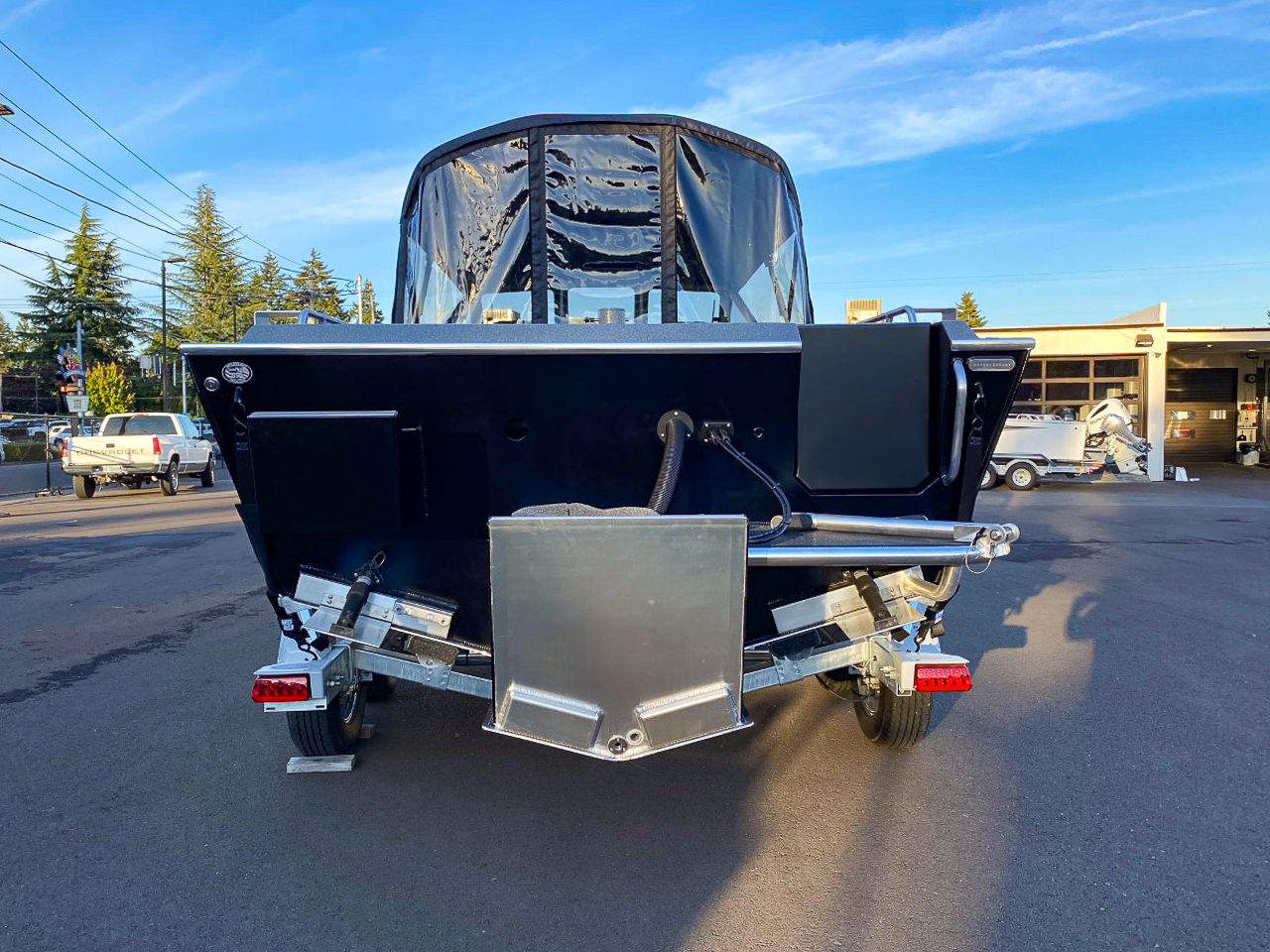 Slide: The Image of 2025 North River 22 Seahawk boat on trailer, rear view. - 4