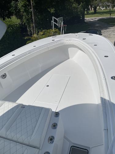 Slide: The Image of 2021 Onslow Bay 41 Tournament Edition boat, spacious deck, white finish, outdoor setting. - 12